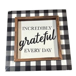 Farmhouse-style decorative sign with the phrase "Incredibly grateful every day"